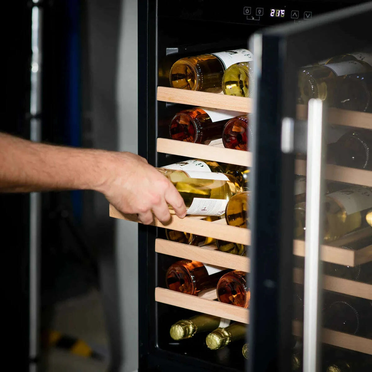 Sleek Baridi wine cooler with glass door, digital controls, fits 54 bottles, modern kitchen style.