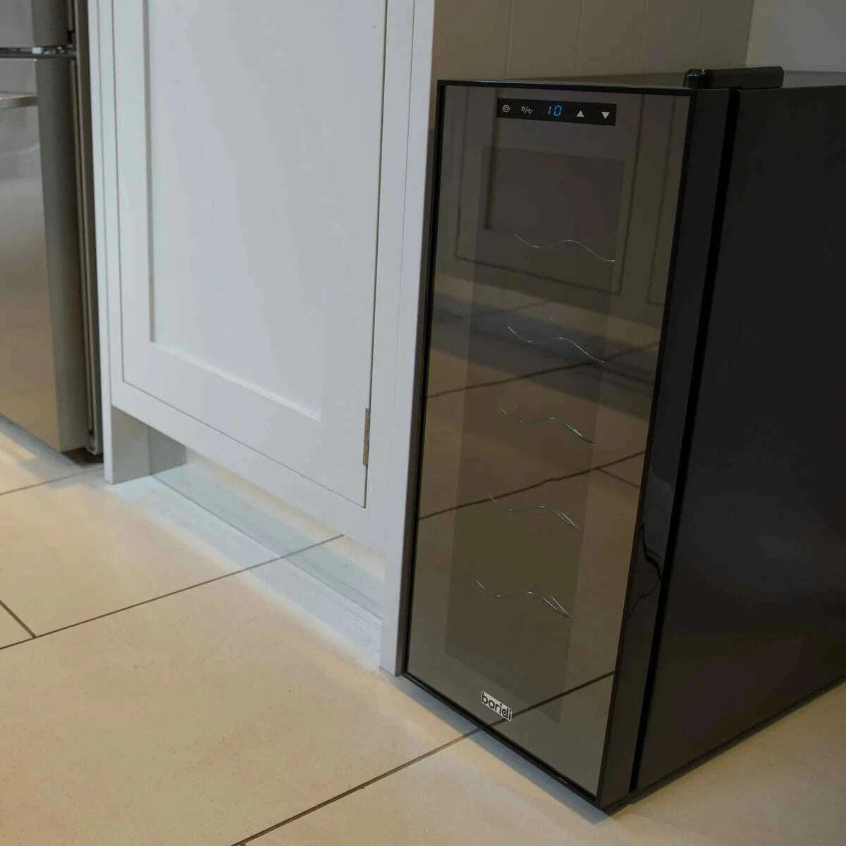Black Baridi 12-bottle wine fridge with touch control and mirrored glass door on a kitchen counter.
