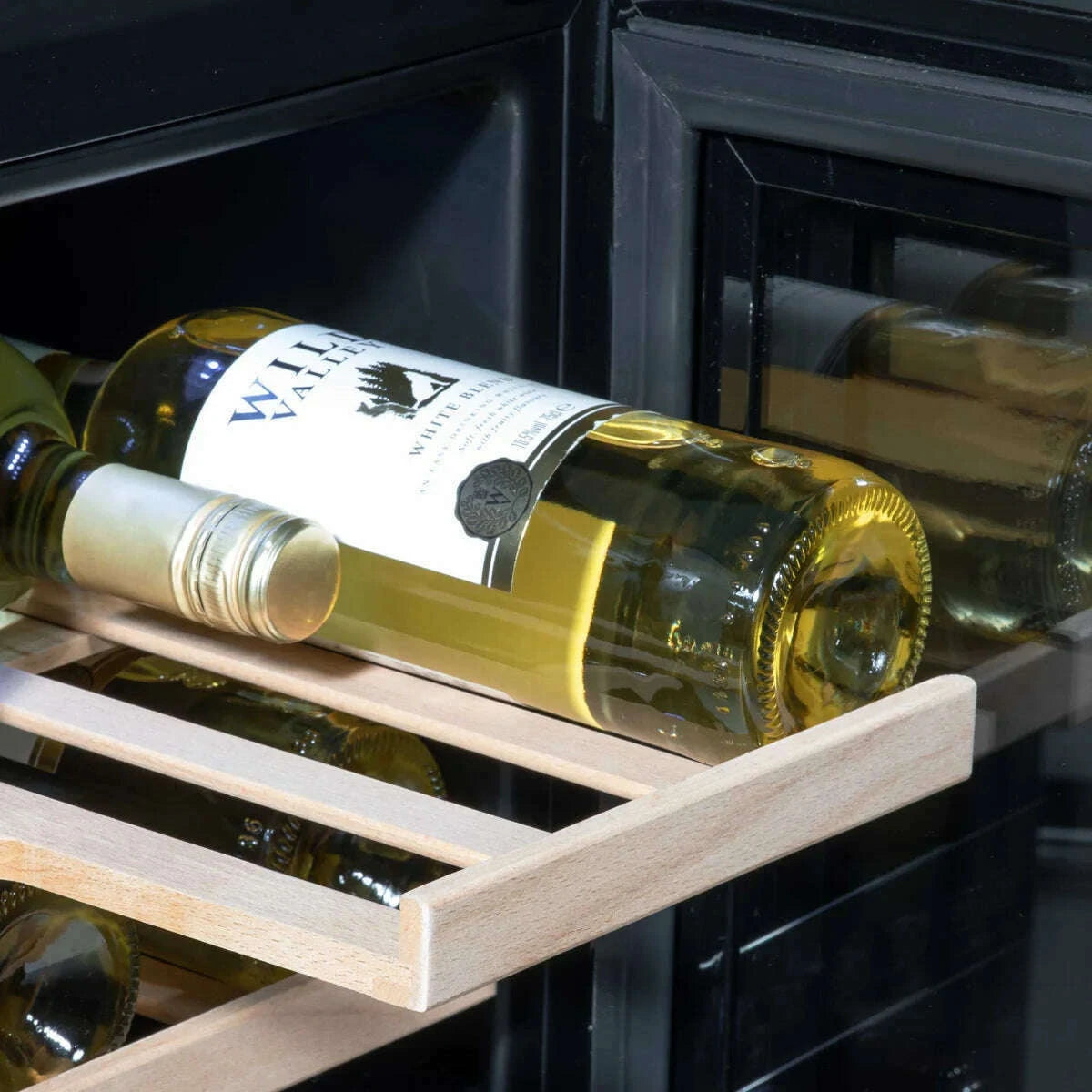 Sleek 30cm wine cooler with touchscreen, fits 20 bottles, beech shelves, LED light, black finish.