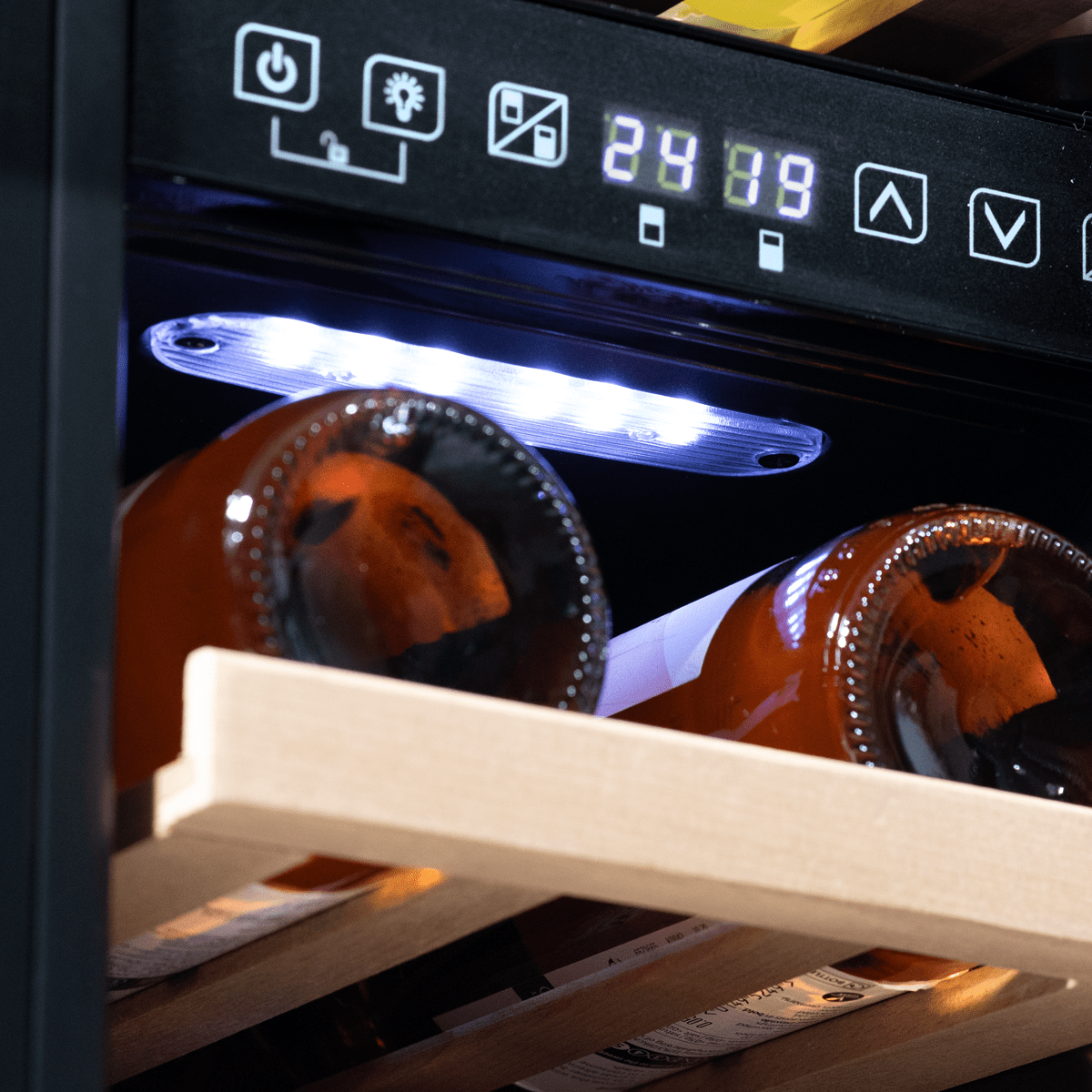 Sleek black dual-zone wine cooler with touch controls, fits 17 bottles, slim 30cm design.