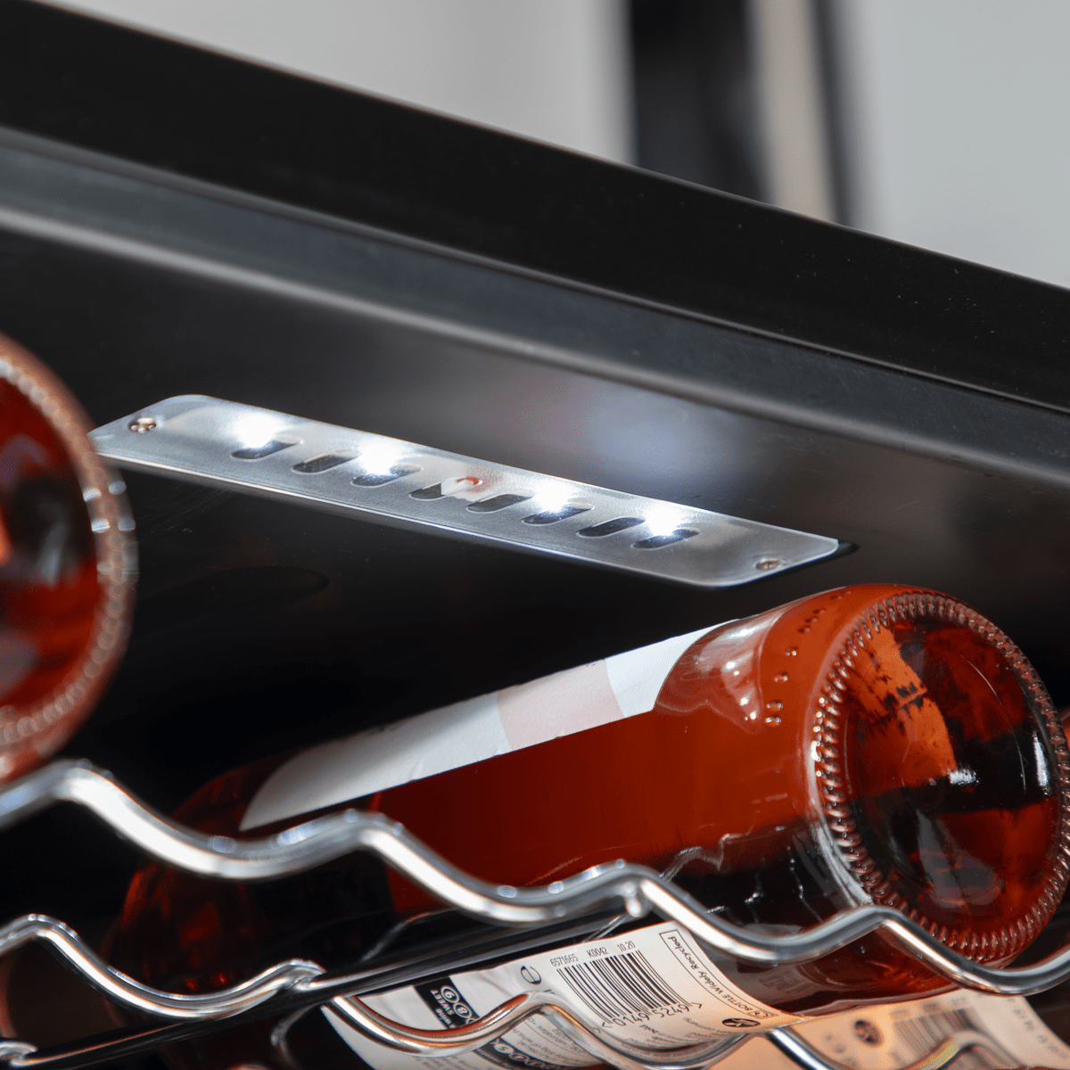 Sleek Baridi wine cooler with dual zones, mirror glass door, and 52-bottle capacity.